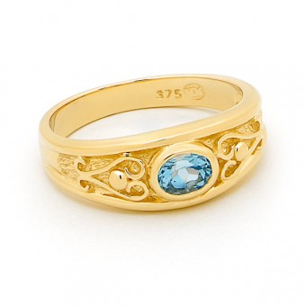 9ct Oval Blue Topaz engraved band.